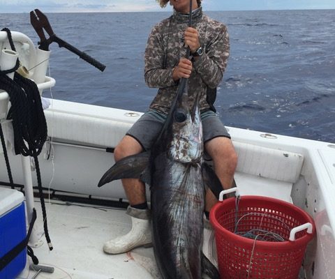 Alex of New Lattitude Sportfishing with a monster swordfish catch