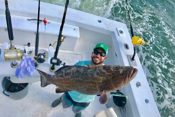 Bobby with a big black grouper caught aboard New Lattitude Sportfishing charters