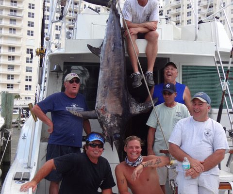 Capt Adam, Ryan and Tyler and some happy anglers with 300 lb Swordfish caught by New Lattitude Sportfishing Charters