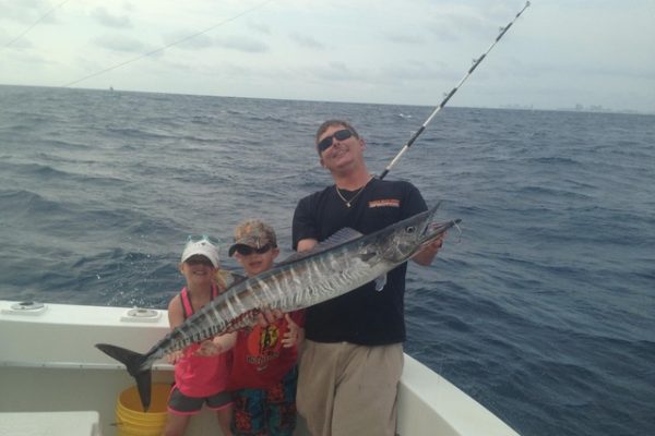 Capt Rod with a nice wahoo caught by these kids sportfishing with