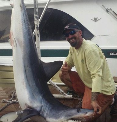 Mick with a nice mako shark caught with New Lattitude Sportfishing
