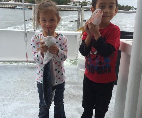 Some cute kids with some cute fish caught on the Catch My Drift